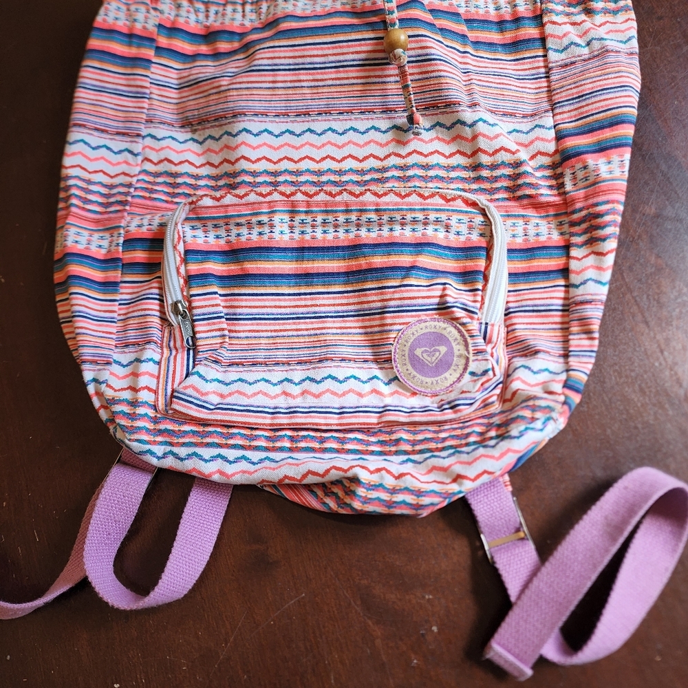 Roxy Backpack has 1 tear picture shows it please look carefully other then that